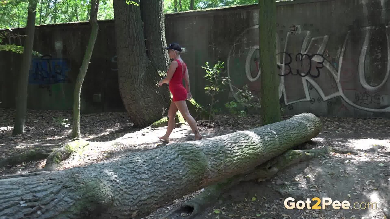 Blonde Girl Licky Lex Takes A Pee Over A Fallen Tree While In The Woods