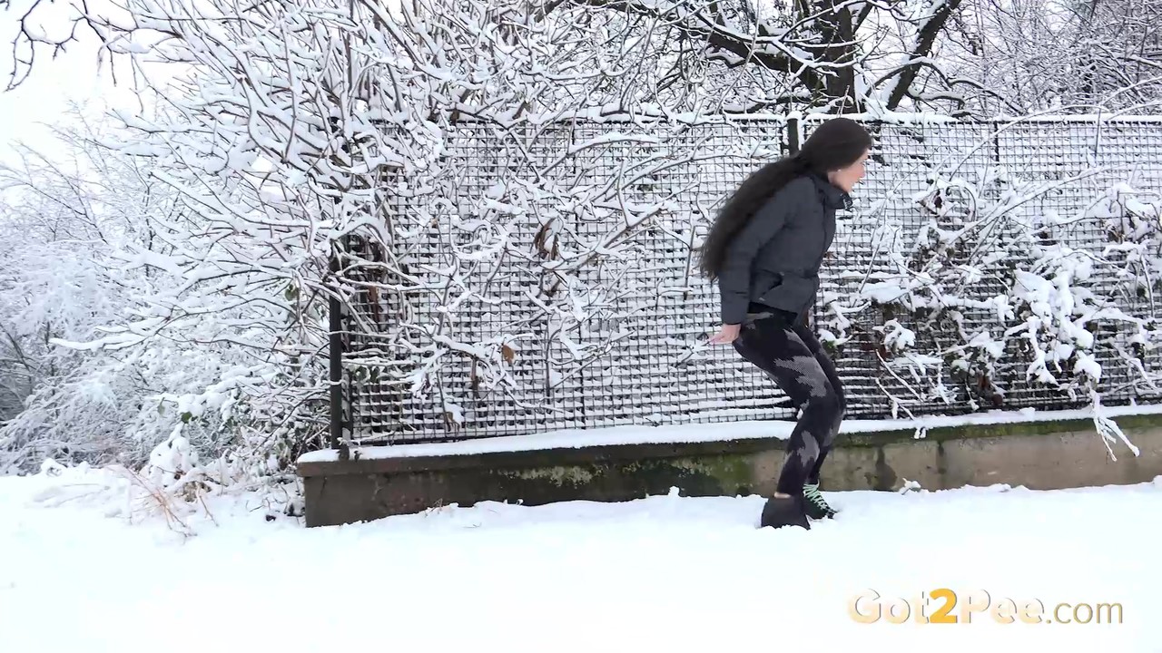 Lara Fox Takes An Urgent Piss On Snow Covered Ground Near Parked Cars