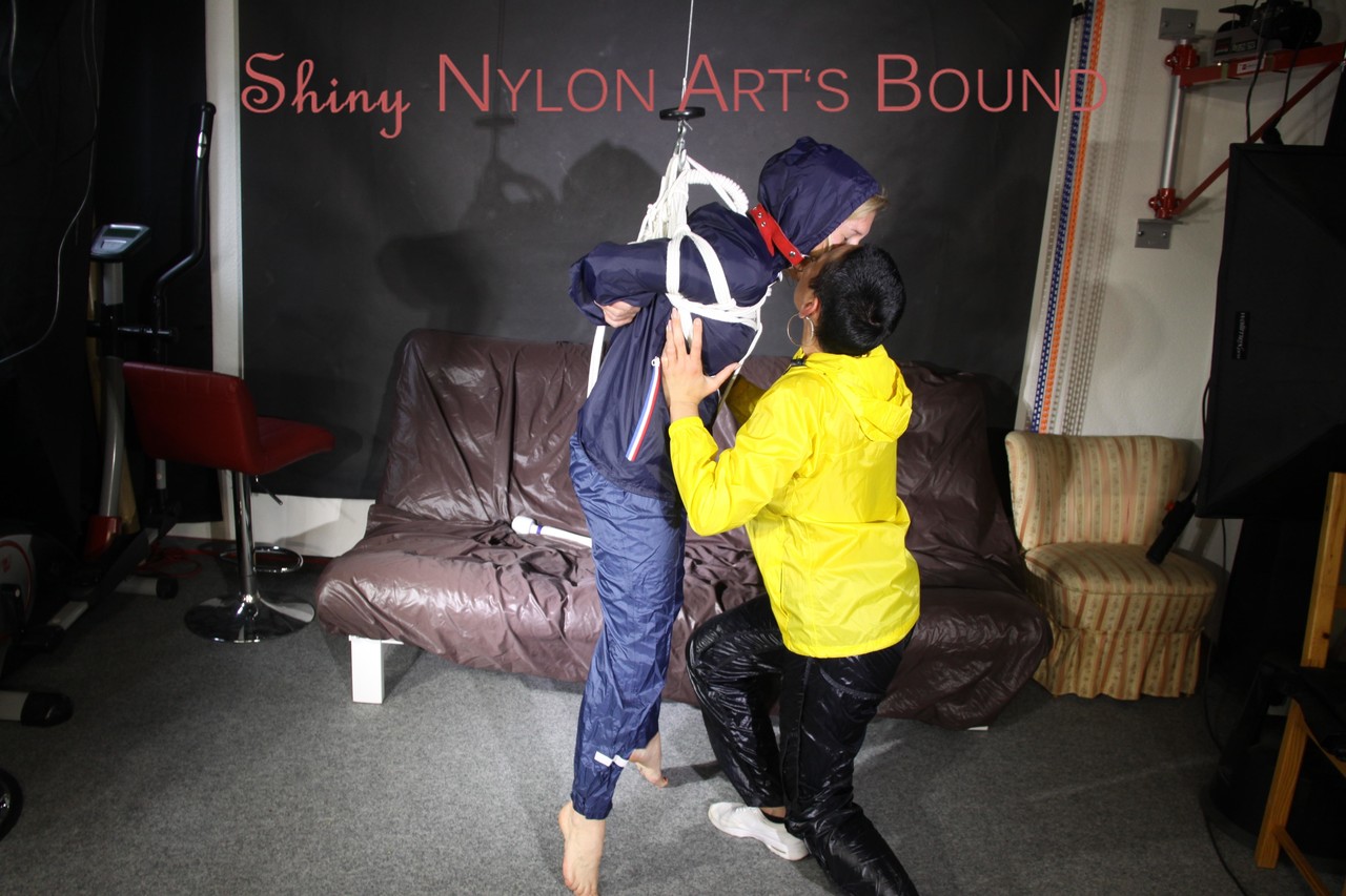 Sandra Beeing Tied And Gagged By Stella In Shiny Nylon Rainwear