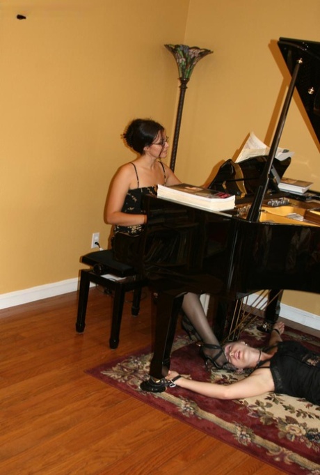 Brunette Pianist Plays While A Restrained Woman Licks Her Heels Nakedpics