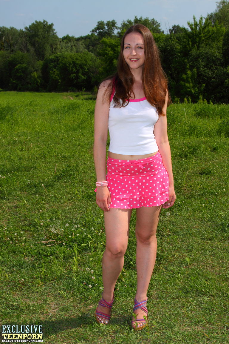 Xlxx Teen - Sweet teen Caroline bares her tiny tits before showcasing her pussy in a  field - NakedPics