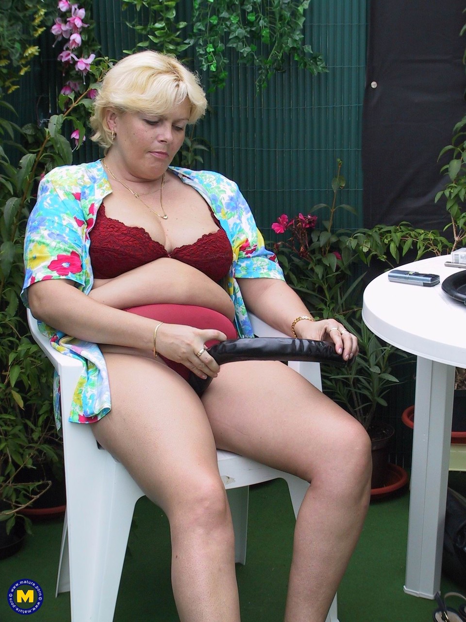 Blonde BBW Andrea strips in the garden & fucks her love hole with a giant  toy - NakedPics