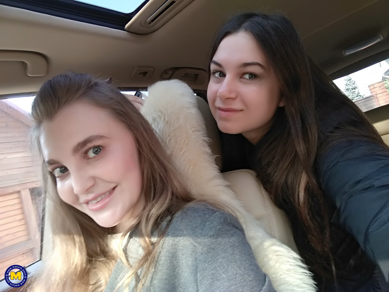 Long haired European lovers take a selfie in the car before lesbian sex  action - NakedPics