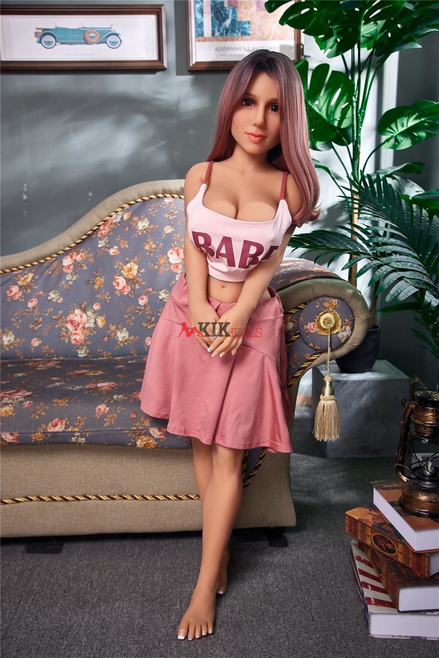 Beautiful mini sex doll teases in a cute outfit shows her