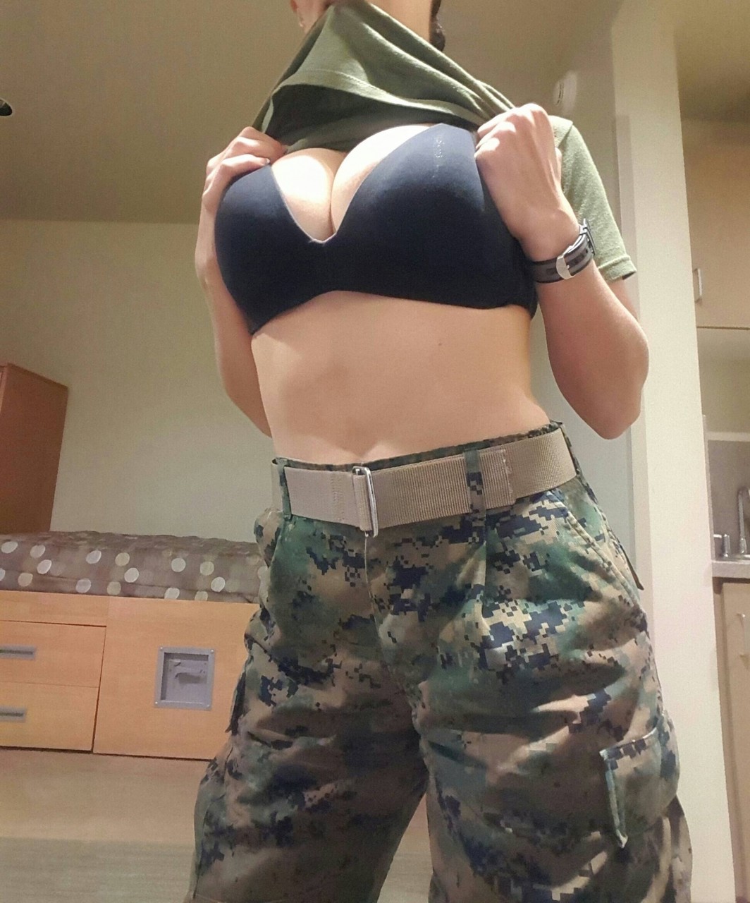 Military babe with awesome big tits flaunts her alluring curves on her bed  - NakedPics