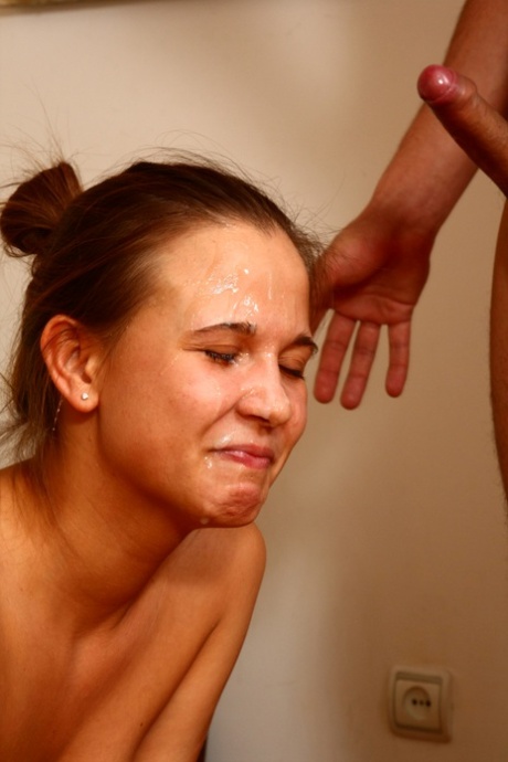 Young girl sports a cum covered face after having sex with her boyfriend