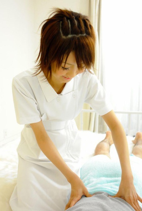 Japanese nurse Miriya Hazuki licks and tugs on a patient