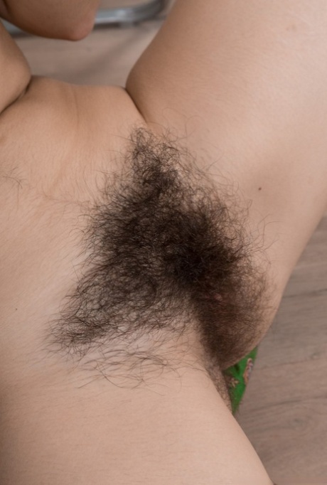 Dark haired Ole Nina removes her white pantyhose to reveal her very hairy muff