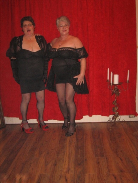 Big titted granny Girdle Goddess and her lesbian girlfriend don strapon cocks