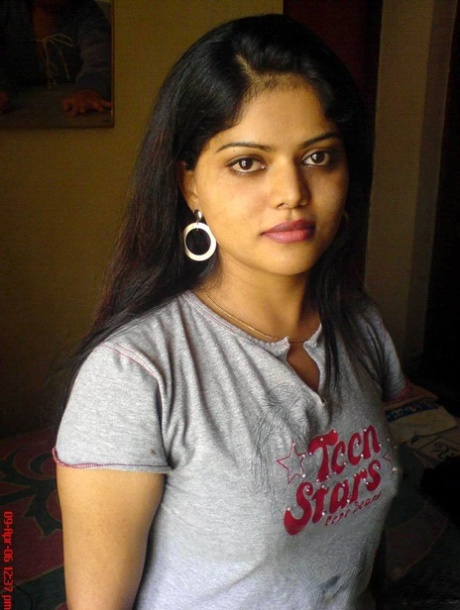 Petite Indian girl uncups big naturals after removing blue jeans