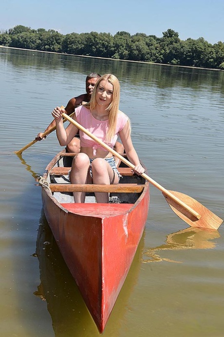 Young blonde and her guy friend canoe out to an island to fuck in nature