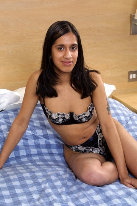 Indian female uncups her natural tits before showing her landing strip pussy