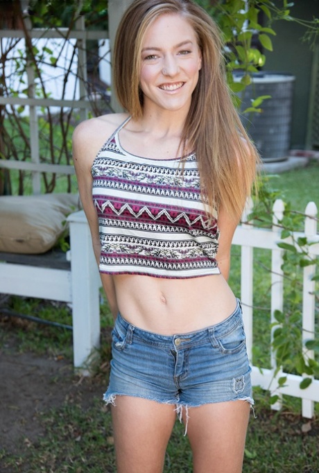 Nice teen Luna Light takes her time in uncovering her small breasts