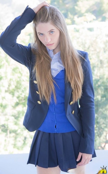 Naughty schoolgirl in uniform makes the grade on her knees