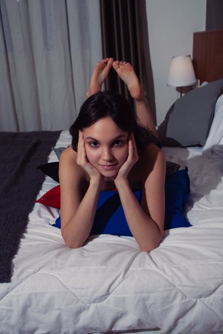 Cute brunette Lara Masier gets completely naked while in her bedroom