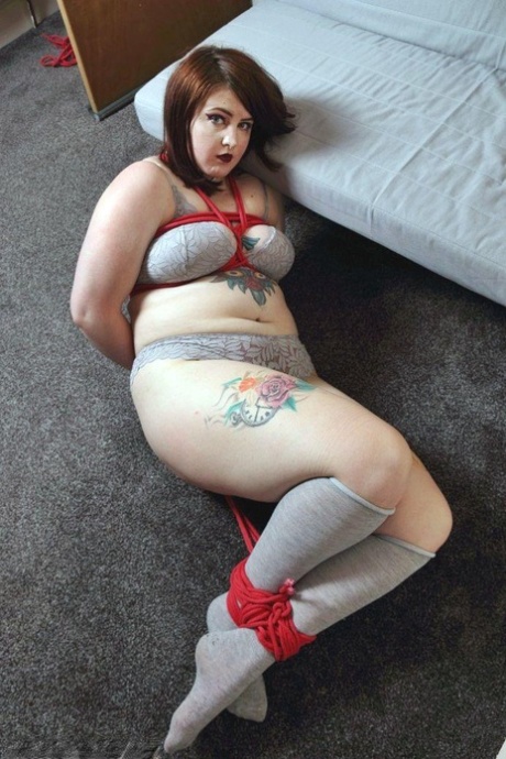 Tatted chubber Luna La Roux is bound with rope while in her underwear & socks