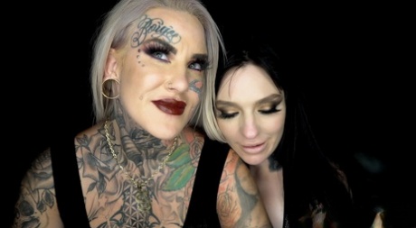 Tattooed lesbians Evilyn Ink & Misha Montana engage in strapon sex