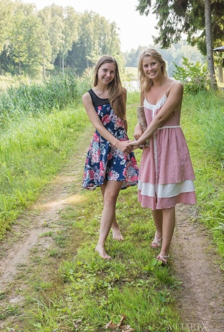 Blonde teens Lara Sugar and Casey Nohrman have lesbian sex on a dock