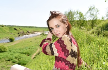 Skinny young girl Pala takes off her sweater to go nude in the countryside