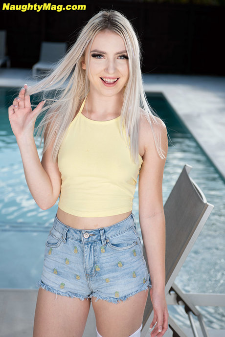 Cute blonde teen Britt Blair exchanges oral sex with a guy near a pool