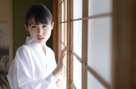 Japanese beauty Manami Ueno goes nude in white socks on throw cushions