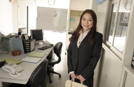 Japanese secretary Yuri Kawana gets naked on top of her desk at work
