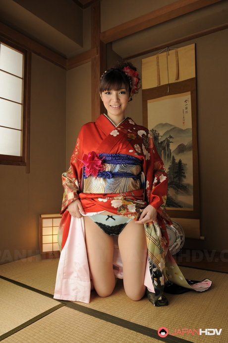 Beautiful Japanese girl Yuria Tominaga removes a kimono to pose nude