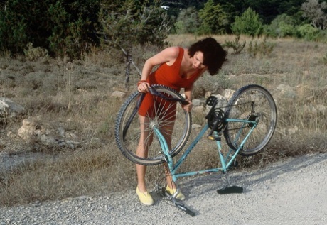 Vintage doll get a flat while bicycling & rewards her helpers with a fuck fest