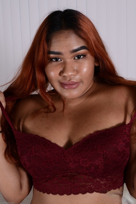 Curvy ebony with red hair Rozey Royalty flaunts her huge ass and tasty bush