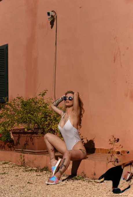British model Saskia Valentine strips her bodysuit and reveals her hot ass
