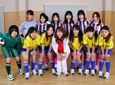 Asian female football team watches as a teammate gets fucked by the referees