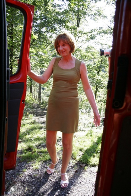 Mature European woman Yvonne blows off two teenage boys outdoors