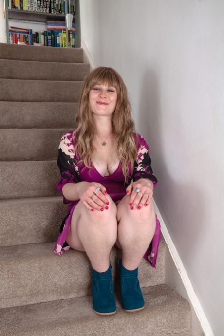 Tattooed doll Betty Busen reveals her juicy tits & hairy crotch on the stairs