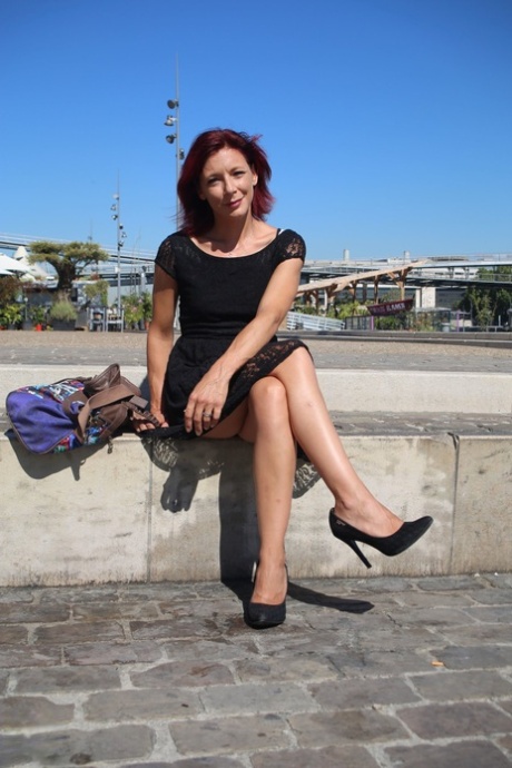 Sexy French redhead mature Morgane Dell flashes her cunt in public