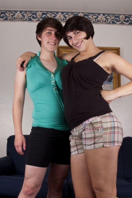 Short haired lesbians Cassie and Zooey expose hairy muffs and get intimate