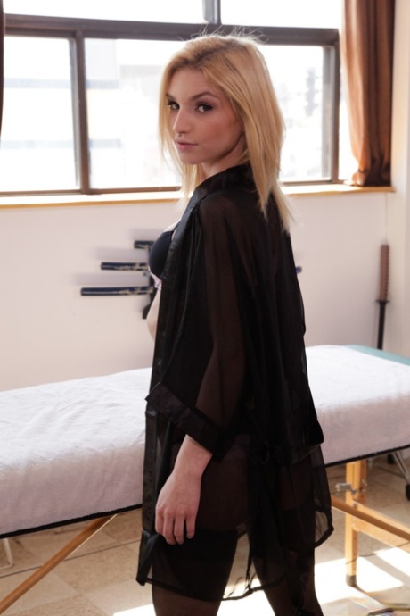 Slim blonde teen Nikita Teen looking cute in a black dress & sexy lingerie