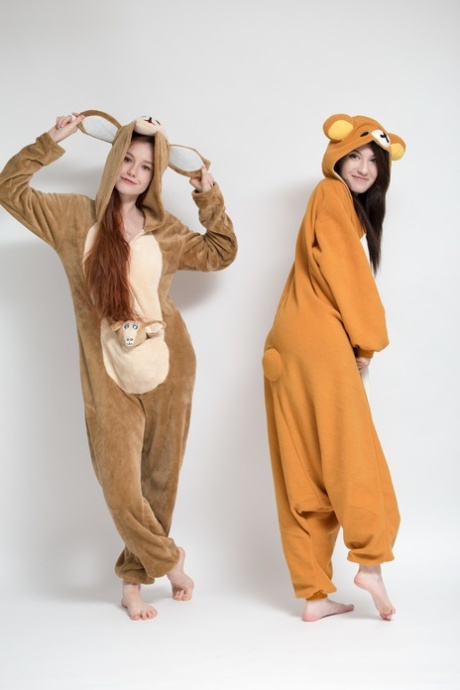 Sweet young Emily and her pal doff their onsies to show hot asses naked