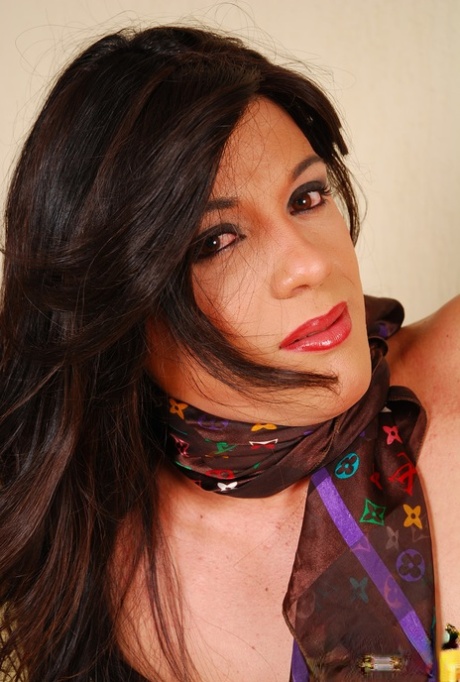Latina shemale Sabrina Slavieiro unveils her small tits and hard rod
