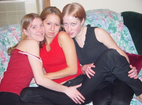 Amateur lesbian teens give each other cunnilingus in an all-girl threesome