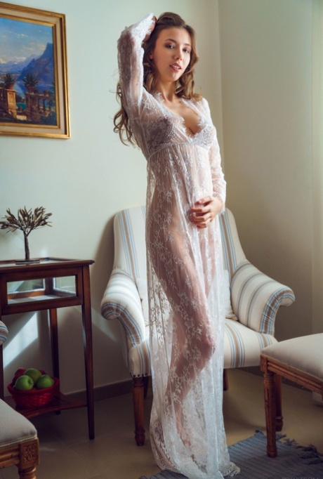 Ukrainian teen Mila Azul unveils her sweet tits while teasing in a lacy dress