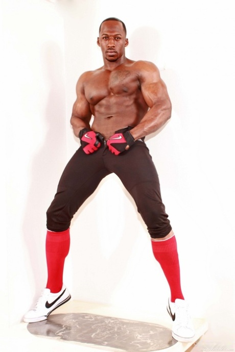 Horny muscular gay Derek Jackson flaunts his huge prick while stripping