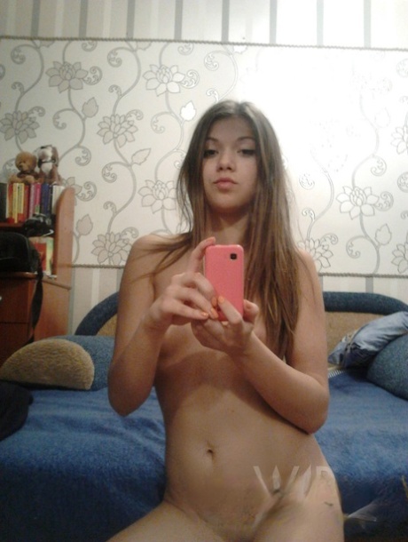 Cute teen babe Helga takes selfies of her amazing naked body in the mirror