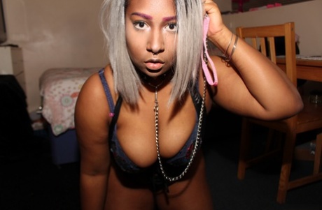 Chubby lingerie-clad ebony Dink Lu teases with her cleavage & big tits