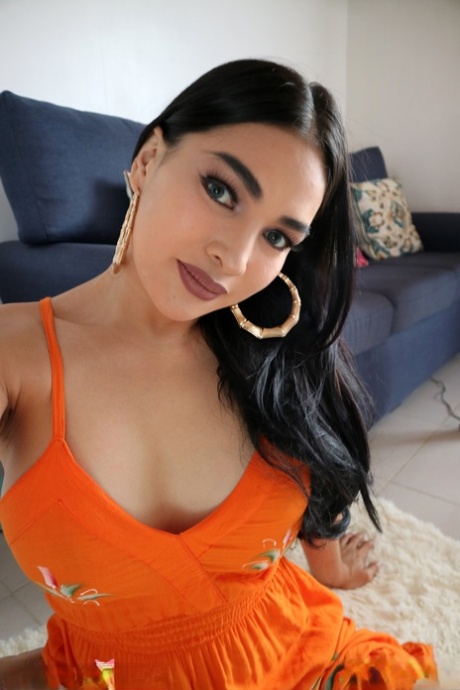 Gorgeous dark haired shemale Filipina flaunts her beautiful boobs