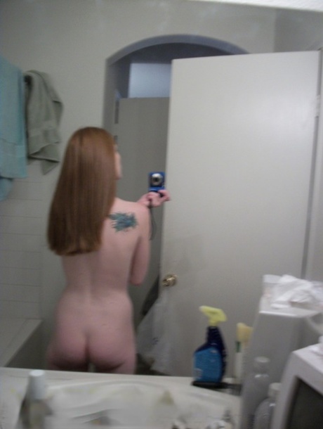Ginger amateur Emily takes selfies of her naked teen body in the mirror