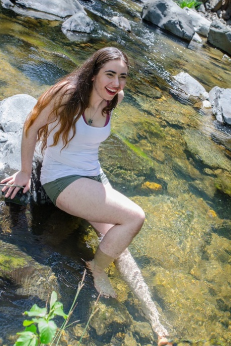 Amateur hippie Kisa Fae undressing by the creek & revealing her hairy body