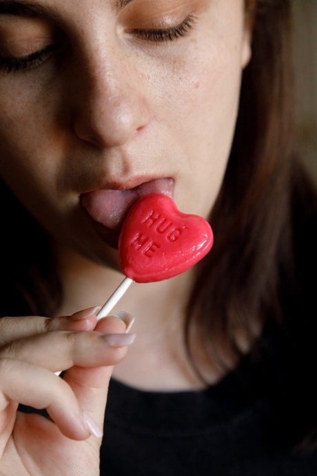 Amateur Milly Marks flaunts her incredible big tits while licking a lollipop