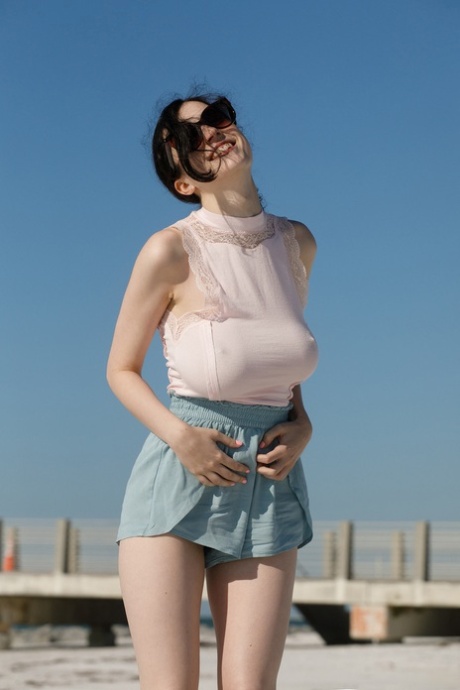 Brunette Ukrainian teen Giulia Wylde exposes her saggy natural tits
