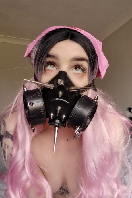 Naughty Quarantine Challenge sheds her nurse costume & poses in a gas mask