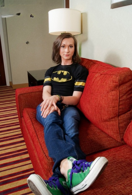 Skinny shemale Jessica Fappit removes her Batman shirt and shows her huge dick